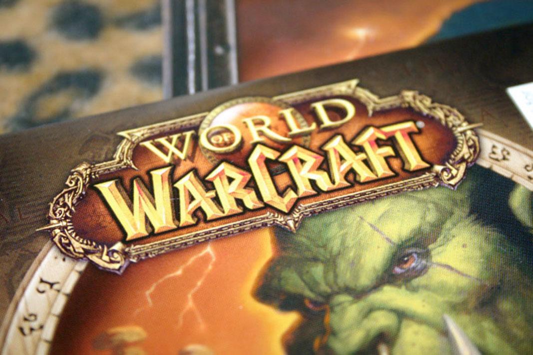 The cover of the video game World of Warcraft, including a green, fanged ogre, is shown here.