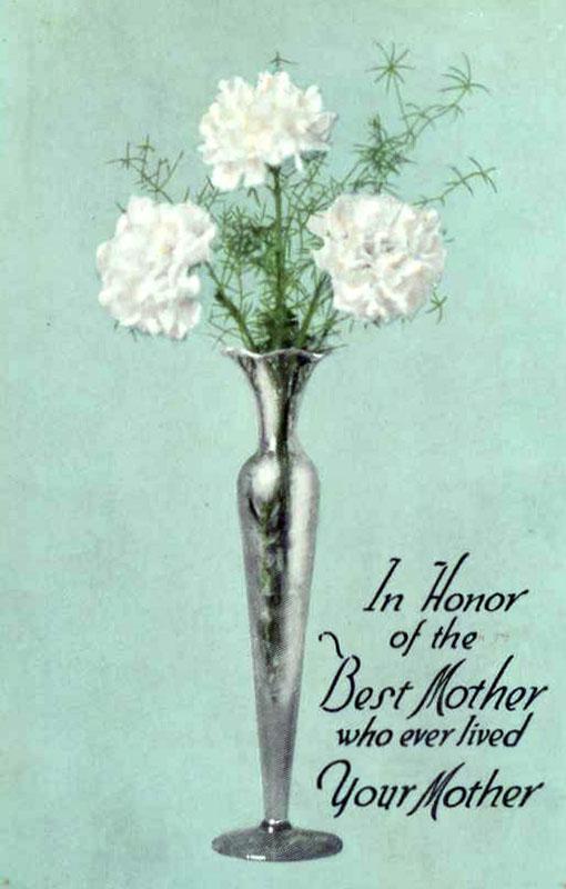 The front of a greeting card, featuring an image of a shiny silver vase holding three white carnations and the words, written in slanting script, “In Honor of the Best Mother who ever lived - Your Mother.”