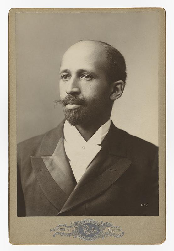 Studio photograph of W.E.B. Du Bois. He wears a formal jacket and sports a neatly trimmed beard and moustache.