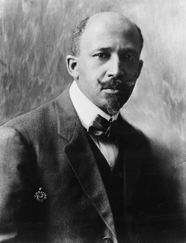 Black and white portrait of a man wearing a vest, suit jacket, and bow tie.