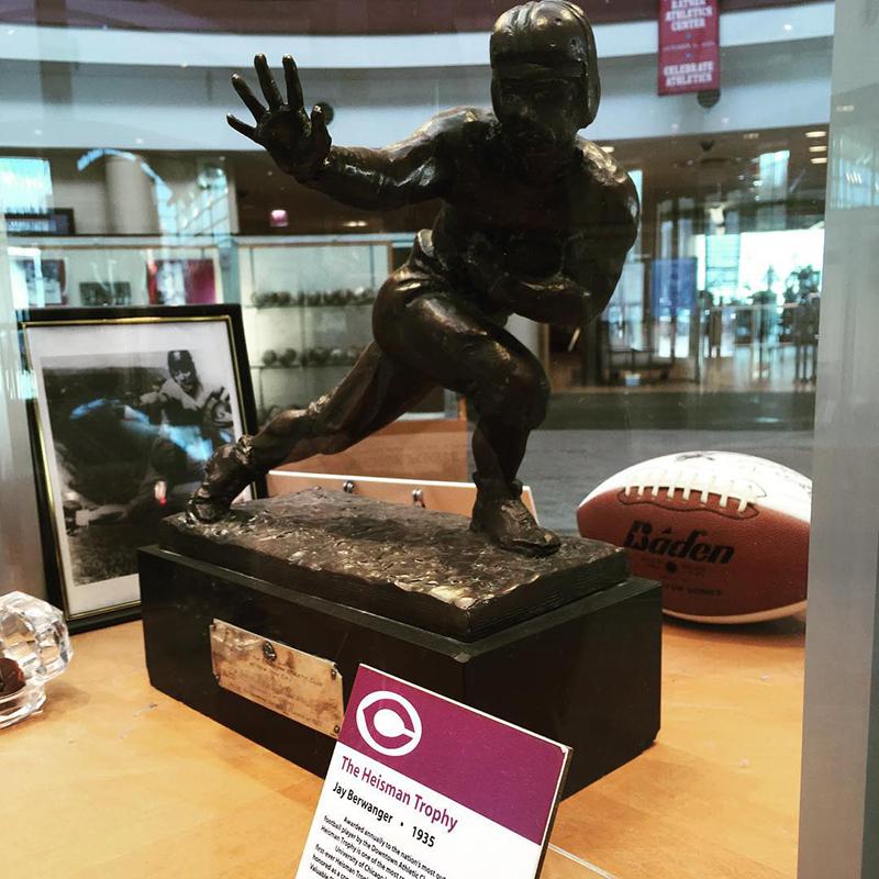 Heisman Trophy in a display glass.