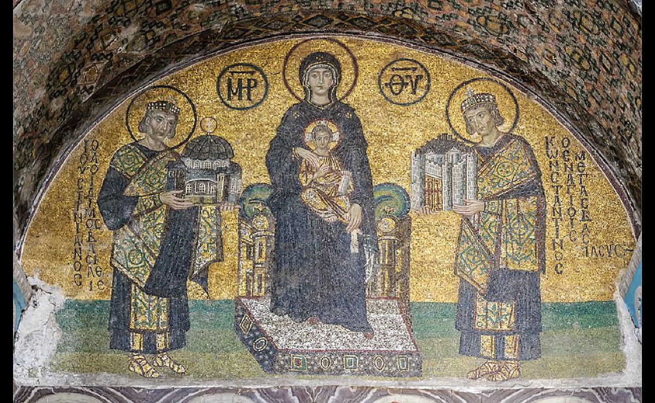 This artwork shows four people. Each has a halo around their head. On the left, Emperor Justinian holds a miniature building. On the right, Emperor Constantine holds another miniature building. In the center, Mary holds the child Jesus in her lap.